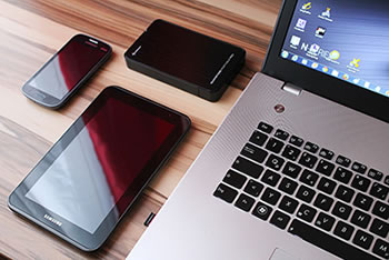 Laptop, smartphone, tablet and harddrive.