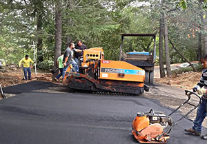 R & R Paving crew paving a driveway on Pinecroft Way in Santa Rosa, California