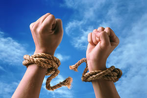 It Training - Hands wrapped in cord that is broken representing the freedom to do your own technology